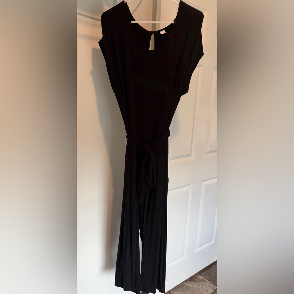 Women’s black short sleeved jumpsuit.